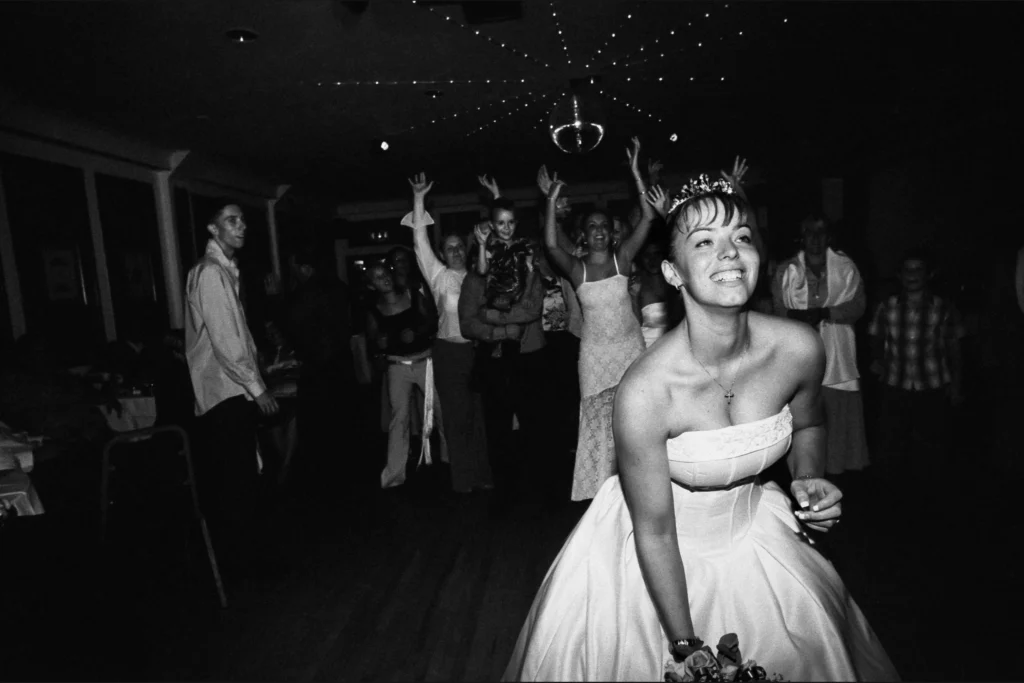 Wedding guests getting ready to catch the bride’s bouquet.
