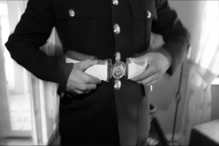 The groom gets ready for the day in his Royal Marine service blues. Groom getting ready for his wedding in Royal Marine service blues.