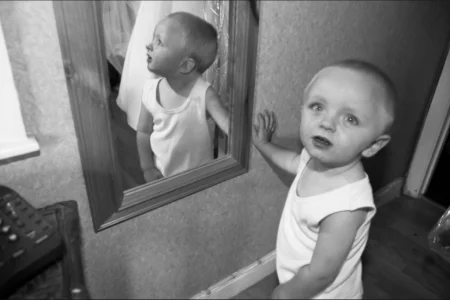 The page boy waits patiently for his turn to get ready. Page boy waiting before getting dressed for the wedding ceremony.