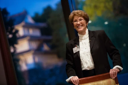 Ginger Griggs delivers a workshop presentation at the American Chamber of Commerce in Japan (ACCJ) Women in Business Summit, with Nagoya Castle at sunset in the background. Ginger Griggs Workshop at ACCJ Nagoya