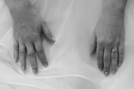 A close-up of the bride’s hands wearing her new wedding ring. Close-up of the bride’s hands wearing her wedding ring in Osaka, Japan.