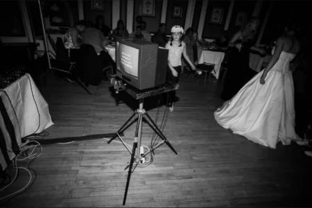 The karaoke begins with “Uptown Girl” by Billy Joel. Wedding guests beginning karaoke with “Uptown Girl” during the reception.