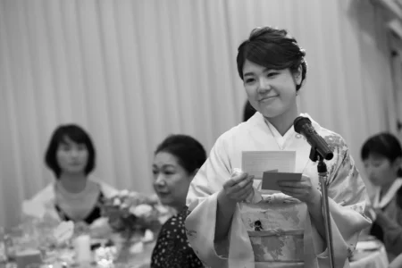 The bride’s best friend gives a speech during the reception. Bride’s best friend giving a speech during their wedding reception in Osaka, Kansai, Japan.