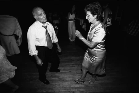 The older generation join the dancefloor and keep the celebration moving. Older wedding guests dancing during the wedding reception.