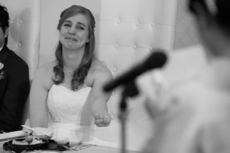 A candid frame from the bride’s best friend’s speech. Bride’s best friend speaking to guests during their wedding reception in Osaka, Japan.