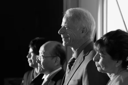 Parents listen during the bride’s speech at the reception. Family members listening to the bride’s speech during her wedding reception in Osaka, Japan.