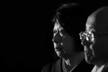 The groom’s mother listens as the bride reads her speech during the reception. Groom’s mother listening to the bride’s speech during their wedding reception in Osaka, Japan.