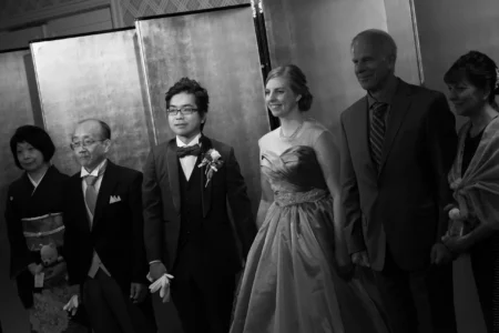 The bride, groom and their families thank guests together during the reception. Bride, groom and families thanking guests during the reception in Osaka, Kansai, Japan.