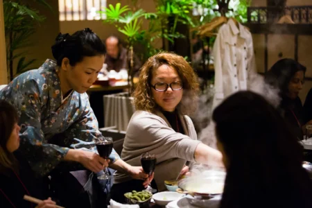 Conference delegates enjoy traditional Japanese cuisine during the ACAH conference dinner in Osaka, Japan. ACAH Conference Dinner in Osaka